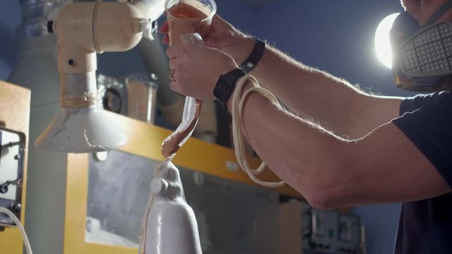 Production of a prosthetic leg. Creates part of the leg above the knee. Pours liquid plastic into a fabric blank.