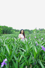 Portrait of beautiful young asian woman relaxing in garden