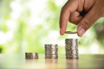 Money, Financial, Business Growth concept, Man's hand put money coins to stack of coins, growing...