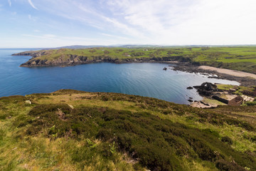 Vista overlooking Porth Wen & the Porth wen Brickworks abandoned site on shore, Isle of Anglesey Coastal Path, Anglesey, North Wales