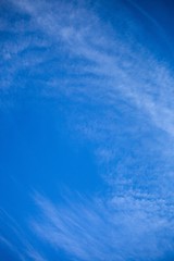 Fototapeta na wymiar blue sky with whispy clouds
