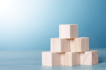 Obraz premium Six Wood Block Cubic on table Blue Tone Background. Free Copy Space.