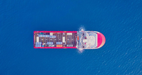 Aerial top view image of an Offshore Supply Ship in the calm ocean water.