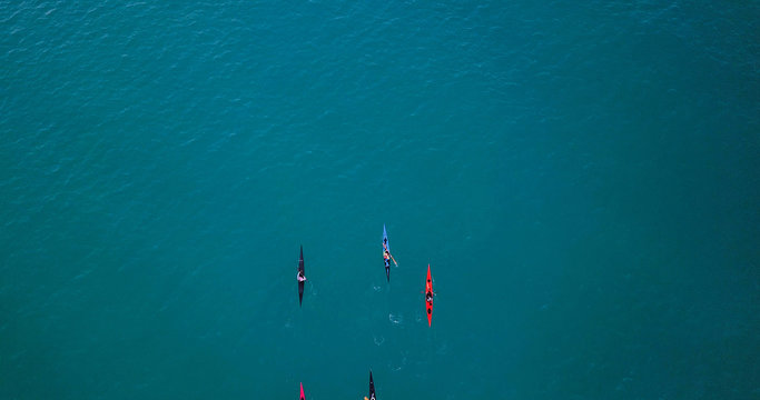 Aerial Image Of Kayakers Paddling Forwards. Sport Canoes And Kayaks At Sea.