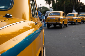 Local yellow taxi waiting for passengers in taxi stand near Victoria Memorial. Yellow taxi is...