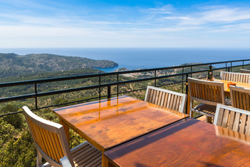 Empty tables overlooking the bay of Port de Soller on the west coast of Majorca. Spain