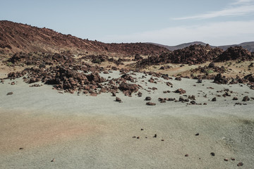 Fototapeta na wymiar The green and red desert landscape of Parco del Teide in Tenerife