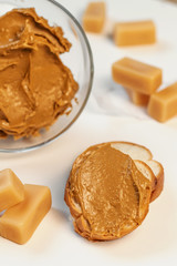 Sweet cream in glass bowl. Confectionery, sweet life, calories. Brown iris cream.