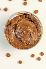 Walnut cream. Sweet cream in glass bowl. Confectionery, sweet life, calories.