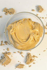 Sweet cream in glass bowl. Confectionery, sweet life, calories.