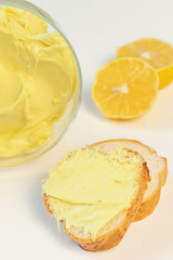 Naklejka na ściany i meble Sweet cream in glass bowl. Lemon sweet yellow cream. Confectionery, sweet life, calories.