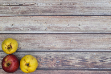 Beautiful autumnal decoration with leaves on wooden background 