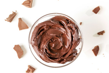 Sweet Chocolate cream in glass bowl. Confectionery, sweet life, calories.