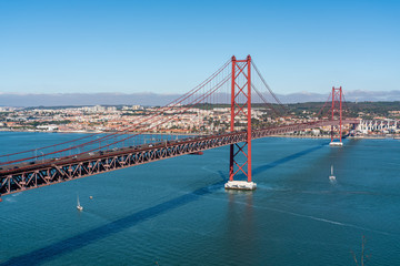 Fototapeta premium April 25 bridge with a view of Lisbon, in the summer. Portugal.