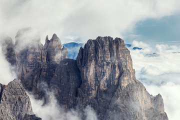 Amazing rocky mountains covered with clouds, Tre Cime di Lavaredo park, Dolomites, Italy © Dmitrii