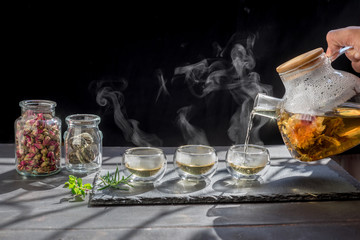 Tea cup with hot tea and tea pot.tea time to brew loose-leaf or flower tea to share with your family and friends.