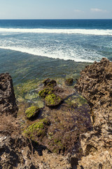 Rocky coastline and waves in Nusa Dua, Bali