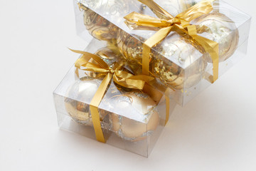 golden gift box with ribbon and bow isolated on white