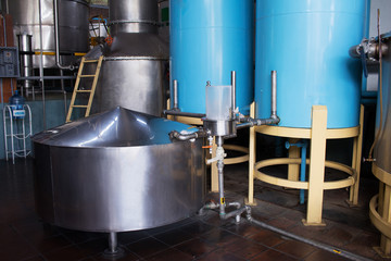 Naklejka na ściany i meble Industrial steel barrels. Alembic still for making alcohol distillery inside