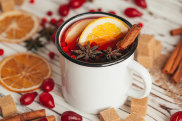 Christmas hot mulled wine in rustic cup close up