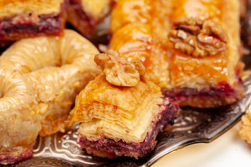 Stacked turkish baklava dessert in a plate close up