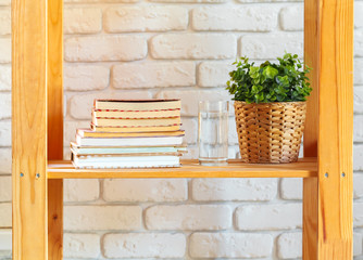 Wooden rack shelf with home decor stuff