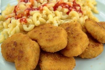 plate of chicken nuggets and pasta