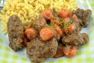 beef and carrot cooked in a dish