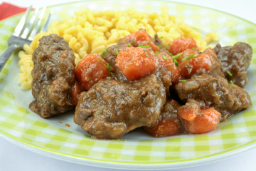 beef and carrot cooked in a dish