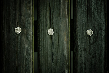 Wooden plank floor with steel nails