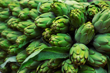 Big ripe organic artichokes for sale at local market.