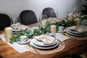 Table served for Christmas dinner in living room.