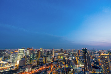 Fototapeta na wymiar Osaka city night life view from top of higg building beautiful sky twilight urban light