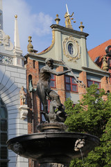 Fototapeta premium Poland, Gdansk - 06.06.2019: View of the Neptune Fountain and the Artus Court.