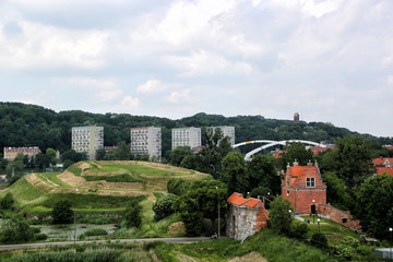 Fototapeta na wymiar Gdansk, Poland - 06/08/2019: View of the old city gates of Brama Nizinna from a hill in the area of fortifications.