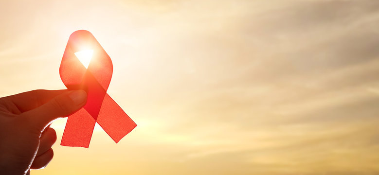 Red ribbon symbol of AIDS and HIV disease.