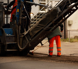 Fototapeta premium Road works with transport and men in uniform