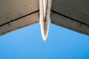 fragment of airplane wings on a background of blue sky