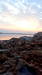 sunset on coast of sea