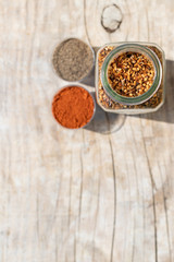 Two jars with spices of different grinding and two small bowls w