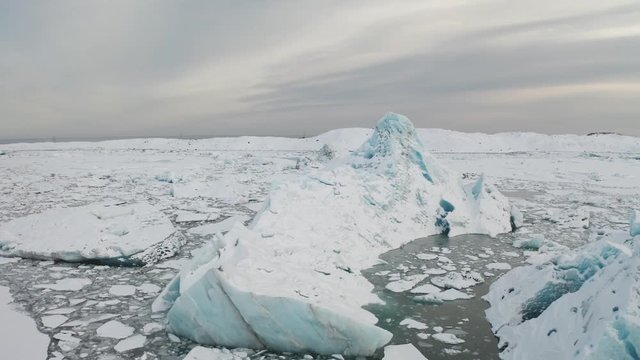 Aerial view of the J kuls rl n glacial lagoon and floating icebergs. The beginning of spring in Iceland