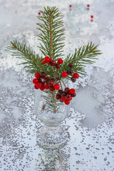 Christmas fir branch with red berries. selective focus