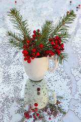 Christmas fir branch with red berries. selective focus