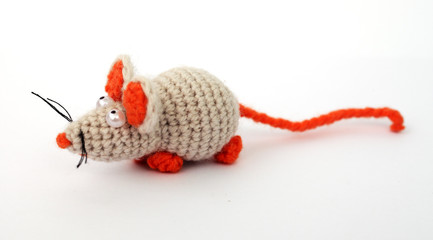 Knitted rat on a white background, close-up