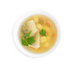 Delicious fish soup in bowl isolated on white, top view
