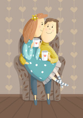 Cute couple with cups on the armchair. Lovers hug.