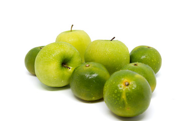 Fresh green apples and oranges isolated on white background.
