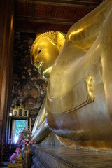 The world's largest sculpture of a reclining Buddha in a temple in Bangkok. © Oleksii