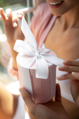 Close up of gift box with a pink ribbon