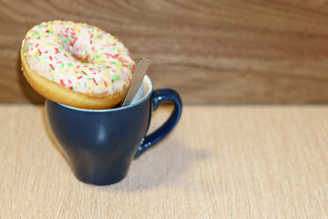 cup of coffee and cookies on wooden table